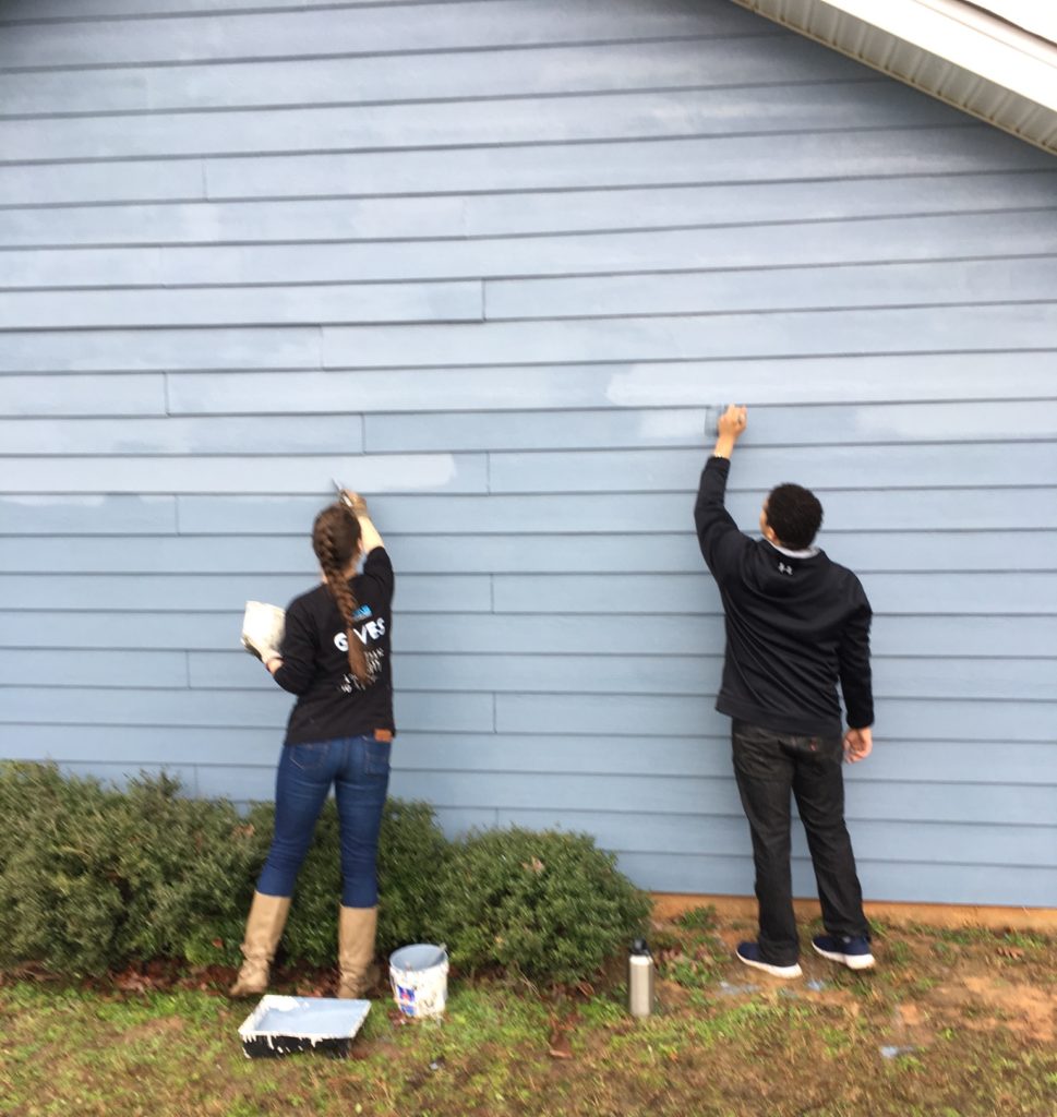 KMS Gives painting Habitat for Humanity House
